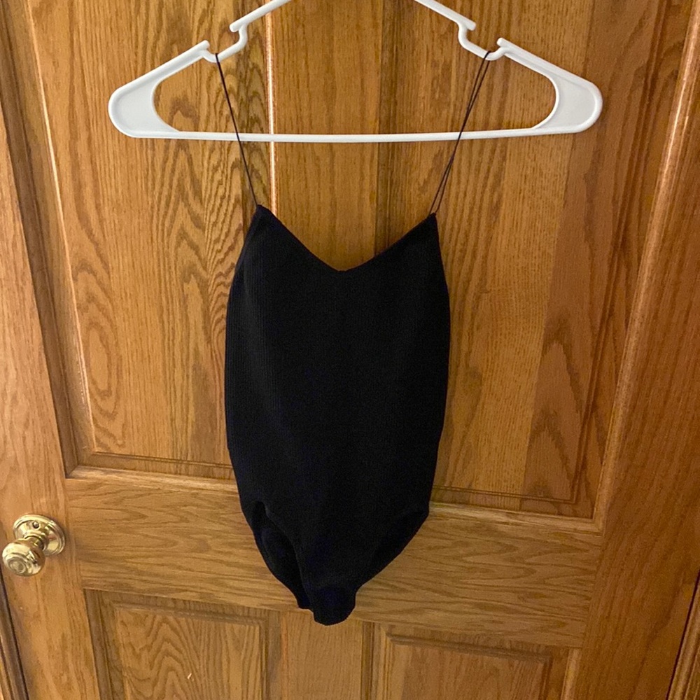 Out from under black bodysuit